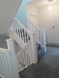herts home extensions white wooden staircase with grey carpet